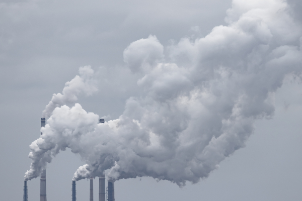 smokestacks putting fumes into the sky